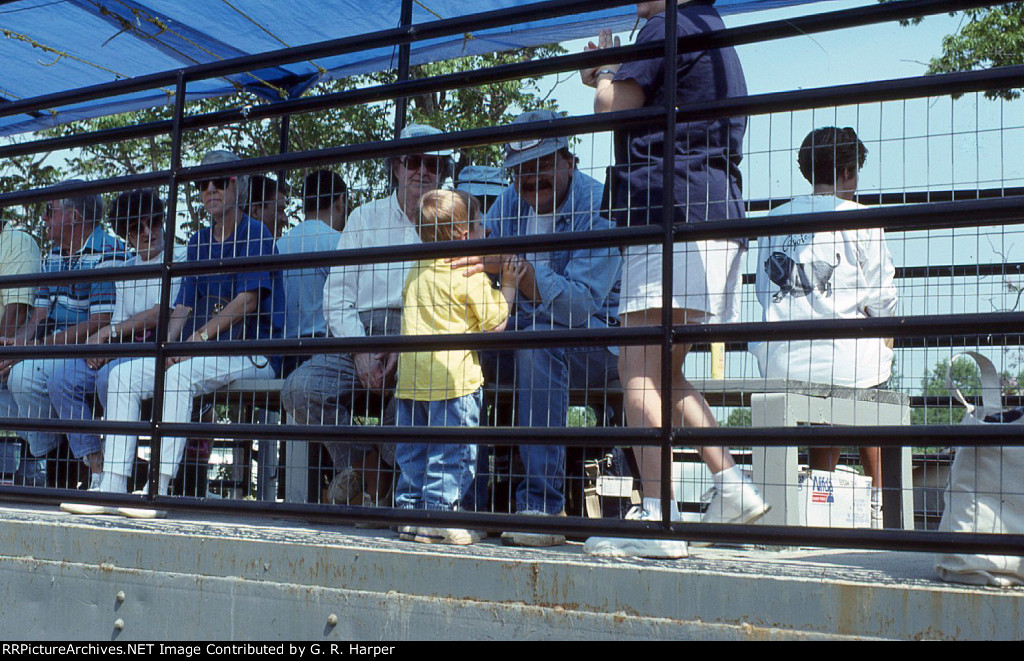 Folks seated in one of the open-air cars prior to departure